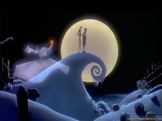 two people standing on top of a snow covered hill in front of a full moon