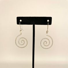 Sterling silver swirl dangle earrings with French hook wires, a unique and elegant design. Handmade by Zuni artist, Carlton Jamon. Measurements: 2" x 0.9" (including wire) Weight: 0.19oz (5.4g) Material: sterling silver (silver925) Southwest Blankets, Native American Crafts, American Crafts, Craft Shop, Pendant Earrings, Ring Bracelet, Ring Necklace, Sales Gifts, Jewelry Shop