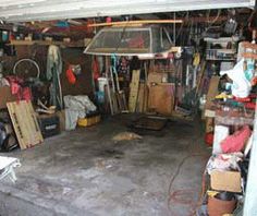 a garage filled with lots of clutter and items