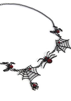 Captivate them with this necklace that has a metallic construction, clasp closures, spider and web designs, and gemstone details. Metal Necklaces With Lobster Clasp For Halloween, Metal Necklace With Lobster Clasp For Halloween, Gothic Party Necklace With Lobster Clasp, Halloween Party Jewelry With Chain Detail, Halloween Party Jewelry With Chain, Adjustable Chain Jewelry For Halloween, Black Necklace Statement, Punk Pants, Dark In Love