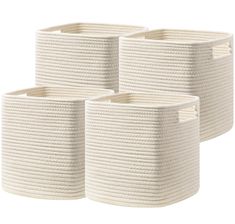 three white woven baskets with handles