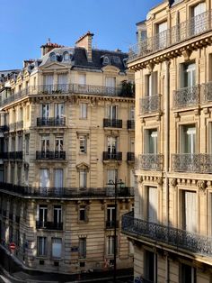 an apartment building with balconies and windows