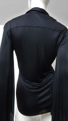 For Sale on 1stDibs - A fabulous black fine stretch silk shirt, top, blouse from Tom Ford for Gucci. It is semi fitted with a shirt collar, black mother of pearl Gucci inscribed Elegant Gucci Blouse For Evening, Elegant Gucci Blouse For Party, Elegant Gucci Party Blouse, Elegant V-neck Party Shirt, Gucci Collared Blouse For Formal Occasions, Gucci Black Top For Night Out, Gucci Formal Collared Blouse, Gucci Long Sleeve Evening Tops, Gucci Evening Long Sleeve Tops