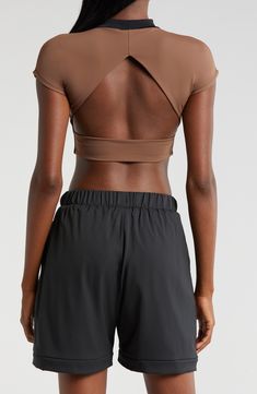 Cut from a double-layer knit with a banded hem, this cropped open-back T-shirt is supportive enough for the weight room and hot enough for the dance floor. Mock neck Short sleeves Nylon/spandex Machine wash, tumble dry Imported Versatile Medium Support Crop Top, Seamless Crew Neck Crop Top For Gym, Seamless Athleisure Crop Top, Athleisure Seamless Crop Top, Compressive Crop Top With Built-in Bra, Versatile Cropped Sports Top, Stretch Cropped T-shirt For Sports, Seamless Cropped Tops For Athleisure, Cropped Stretch T-shirt For Sports