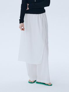 This is a modern and unique pants with skirt by ahwe that is made out of high quality and sturdy fabric. With minimal design detail and trendy mood, you can style it for your casual and refined daily outfit.- Elastic waistband- Skirt layered on top of the pants- Relaxed wide silhouette Modern White High-waisted Wide Leg Pants, White High-waisted Wide Leg Pants, Modern White Ankle-length Wide Leg Pants, Modern White Straight Pants, Chic Relaxed Skirt For Daywear, White Culottes For Workwear In Spring, White Culottes For Spring Workwear, Versatile White Bottoms With Elastic Waistband, White Ankle-length Culottes For Spring