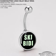 a black and green glow belly ring with the words ski bid on it's side