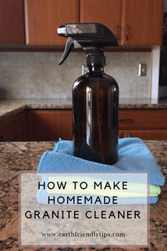 a brown spray bottle sitting on top of a kitchen counter next to a blue towel