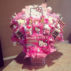 a hello kitty candy bouquet is displayed on a table