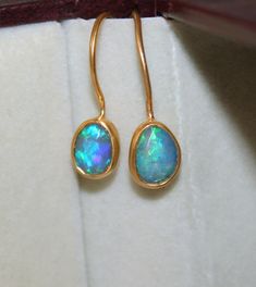 Ethiopian Opal Earring - Solid Gold Ethiopian Opal Earrings - Handmade Gemstone Earring  Stone Size  - 6 to 8 MM Closure: Ear wire Style: Boho & hippie  Gold olor Options -  Yellow Gold, White Gold, Rose Gold  Ready to Ship 1-2 week  Available Yellow, Rose Gold ( also in 9K, 10K, 14K, 18K, 22K ) Customization is available, I also can make it with 9k,10k,14k,18k,22k solid gold (white or rose), and diamond accent stone, just feel free to contact me.  *    PACKAGING: The Ring will be delivered in i Luxury Ethiopian Opal Gold Jewelry, Luxury Gold Jewelry With Ethiopian Opal, Luxury Ethiopian Opal Heirloom Jewelry, Opal Stone Earrings, Luxury Yellow Gold Opal Earrings, Luxury Ethiopian Opal Teardrop Jewelry, Ethiopian Opal Earrings, Opal Earring, Stil Boho