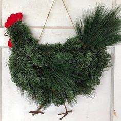 a christmas wreath hanging on the side of a door