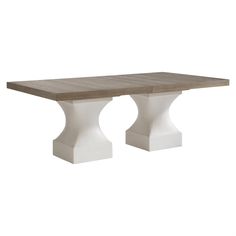 a table with two white pedestals on the top and one in the middle, against a