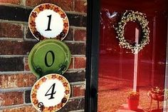 the front door is decorated with wreaths and numbered numbers for each number to be placed on