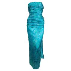 Dramatic, ruched, teal silk brocade, demi-couture dress with hidden corset from Jean-Louis Scherrer dating to the late 1970's. Labeled a French size 36. Dress measures approximately 33" at bust 25" at waist and 36" at the hips. Zips up center back and secures with a hook/eye. Hand finishing throughout. Fully lined. Made in France. Very good condition. Teal Blue Dress, Jean Louis Scherrer, Ruched Gown, Teal Cocktail Dress, Silk Evening Dress, Couture Evening Dress, Blue Evening Gowns, Blue Silk Dress, Haute Couture Dresses