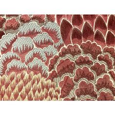 an intricately designed red and beige fabric