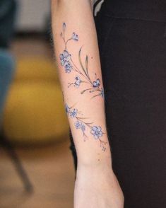 a person with a flower tattoo on their arm