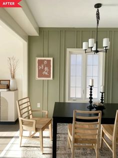 a dining room with green walls and white trim on the wall, two wooden chairs are in front of a black table