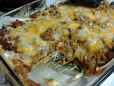 a casserole dish with meat, cheese and sauce on it is ready to be eaten