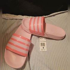 Adidas Women's Adilette Shower Slides Pink/White Sandals Size 9. Slides Are Brand New, Never Worn, Without Box. Adidas Sporty Slides For Summer, Sporty Synthetic Flip Flops For Spring, Adidas Casual Slides For Spring, Adidas Slides For Spring, Sporty Summer Flip Flops, Comfortable Adidas Flip Flops For Summer, Adidas Slides With Cushioned Footbed For Spring, Casual Adidas Flip Flops For Spring, Sporty Synthetic Slippers For Spring