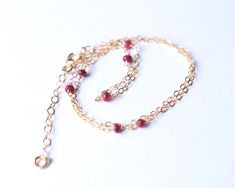 "Custom Length Sterling Silver / Gold Filled Genuine Ruby Beaded Necklace - 30th, 40th 50th 60th 70th Birthday Gift - July Birthstone Jewelry Minimal sterling silver or 14k gold filled necklace with 3-7 natural rubies. The perfect birthday gift. ✦ Comes in 14-18\", with additional 1\" extension chain ✦ The rubies are 2-3mm. Ruby has been originated from corundum family. Corundum of all colors is acknowledged as sapphire, except shades of red. Ruby is the traditional birthstone of those born in J Jewelry Minimal, Saturn Necklace, Peridot Necklace, 70th Birthday Gifts, Ruby Beads, July Birthstone Jewelry, Ruby Necklace, Tiny Earrings, Ruby Jewelry