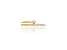 two yellow gold rings with white diamonds on each one, set against a white background