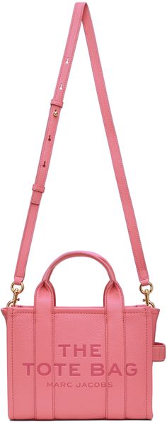 Grained leather tote in pink. · Twin carry handles · Detachable shoulder strap · Logo embossed at face and back face · Carry handle at side · Bumper studs at base · Zip closure · Zip pocket and elasticized welt pockets at interior · H8 x W10 x D5 in Supplier color: Morning glory Money Girl, Face Logo, Logo Text, Mini Tote Bag, Mini Tote, Embossed Logo, Leather Mini, Leather Tote Bag, Luxury Streetwear