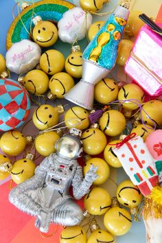 a table topped with lots of different types of ornaments and decorations on top of each other