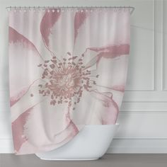 a pink and white flower shower curtain hanging on a bathroom wall next to a toilet