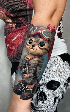 a person with a cat tattoo on their arm