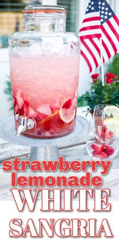 strawberry lemonade white sangria in a glass with ice and garnishes