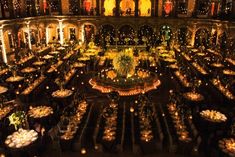 an elaborately decorated banquet hall is lit up at night