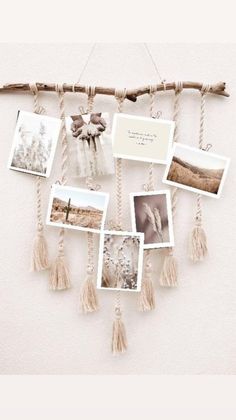 a bunch of pictures hanging on a wall with some tassels attached to it