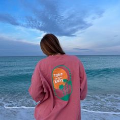 Say hello to summer with the most vibrant Take It Easy crewneck! These crews feature a sunset and palm trees across the back and Blue Horizon Surf Shop branding on the front. Brand: Hanes, unisex fit, runs oversized (see sizing chart for details) Sunset And Palm Trees, Shop Branding, Embroidered Crewneck, Take It Easy, Surf Shop, Sizing Chart, Say Hello, Summer Collection, Palm Trees