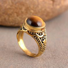 "Tiger Eye Ring, Handmade Ring, Wedding Ring, Tiger's Eye Ring, Gift For Her, Anniversary Ring, Promise Ring, Dainty Ring, Mothers Day Gift Size:- All Size Available In Variation Metal:- Silver Stone:- Tiger Eye Size:- All Size Available In Variation Metal:- Brass 1 product free gift on purchase of 3 products. You can choose the plain brass ring free gift as your wish. Take a screenshot of plain brass ring you like from my shop and send me a photo in personal message. MUST READ....👇 5 stars is Spiritual Round Promise Rings, Brown Round Rings For Anniversary, Handmade Brown Ring For Wedding, Spiritual Round Crystal Ring For Wedding, Spiritual Open Crystal Ring For Wedding, Spiritual Crystal Open Ring For Weddings, Wedding Stackable Brass Rings, Brass Gemstone Rings For Anniversary, Spiritual Round Rings For Anniversary