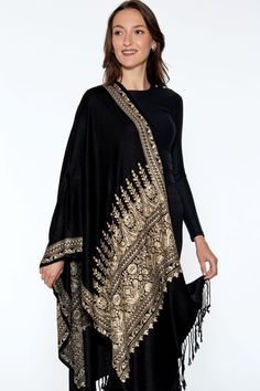 Our Vimala Embroidered Shawl features exquisite embroidery on soft 100% viscose that has the look and feel of wool, but can be worn by people with wool sensitivities. This classically beautiful shawl showcases the intricate embroidery traditions of Northern India in golden hues on a black base.  Dimensions: 28" x 78" Iran History, Embroidered Shawl, Black Shawl, Boutique Dress Designs, Boutique Dress, Intricate Embroidery, Dress Designs, Shawls And Wraps, Cotton Tops