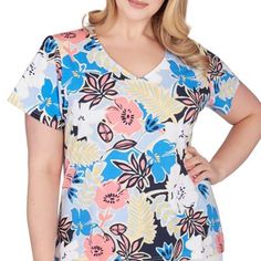 In this printed stretch jersey top, you are sure to stand out at every event. This top features a V-neck. | Hearts of Palm Women's Printed Essentials Short Sleeve Top, Blue, 1X Stretch V-neck Top With Graphic Print, Stretch Floral Print V-neck Top, Spring Floral Print Elastane Tops, Spring Floral Print Tops, Summer Floral Print Elastane Top, Printed Stretch Elastane Tops, Stretch V-neck Tops With Graphic Print, Blue V-neck Elastane Top, Multicolor Stretch V-neck Top