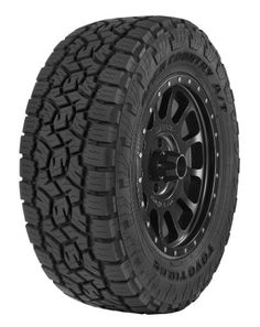 an all terrain tire on a white background