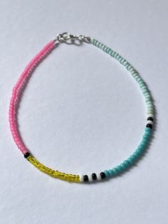 a bracelet with two different colored beads