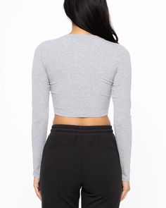 From warm up to workout to lounge, this cropped shirt is a must-have addition to your wardrobe. Our seamless crop top features a four way stretch fabrication designed to fit and flatter everyone. Breathable fabric with lots of stretch. Ribbed fabrication. Cropped silhouette. Perfect for everyday wear: style it as a base layer in the winter, throw it on over a sports bra for a workout, or pair with your favorite high waisted jeans. FIT & FABRIC True to size: Slim fit, cropped length, and classic Cozy Lounge, Denim Essentials, Closet Essentials, Fall Denim, Crop Shirt, Long Sleeve Crop Top, High Waist Jeans, Wardrobe Staples, Wardrobe Essentials