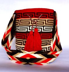 Mochila purse made by artisans of the Wayuu Indigenous Group in Colombia Purchased directly from Artisan, on a Fair Trade Basis Fully Handmade For each Wayuu Mochila Bag purchased, Hands of Colombia donates thread to Indigenous Artisans. Only ONE available Wayuu Mochila Purses are famous for their stunning designs and unique character. Each purse is handmade, full of expression and character. SIZE - Large. 12 inches deep (30.5cm), 13 inches wide (33cm). Comfortably fits large items: use as an ev Traditional Bucket Shoulder Bag As Gift, Handmade Red Bucket Crochet Bag, Handmade Red Bucket Bag For Travel, Red Handmade Crochet Bucket Bag, Handmade Red Crochet Bucket Bag, Artisan Woven Shoulder Bag As Gift, Artisan Woven Shoulder Bag Gift, Traditional Rectangular Bucket Bag As Gift, Traditional Handmade Multicolor Bucket Bag