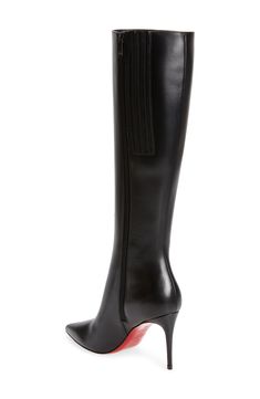 A streamlined design puts the focus on the sharp pointy-toe silhouette, supple leather and Louboutin-red sole of this ultra-versatile tall boot. 3 1/4" (85mm) heel; (size 38.5) 16" shaft; 11 1/2" calf circumference. Narrow calf Side zip closure Wipe with a soft, dry cloth and store in a dust bag Please note the red lacquer on soles will wear off as a result of normal use. To minimize the effect, avoid wearing in wet weather or on abrasive surfaces Leather upper, lining and sole Made in Italy Wom Kate Louboutin, Louboutin Boots, Christian Louboutin Kate, Louboutin So Kate, Christian Louboutin Boots, Leather Knee Boots, Christian Louboutin So Kate, Red Louboutin, Patent Leather Boots