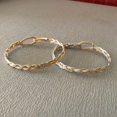 These bracelets are braided using a standard three-strand pattern, just like you would use when braiding hair or rope. The large hook and eye closure is part of the entire design, and allow the wearer to hook and unhook the bracelet with one hand; no helper should be needed! I have two variants: silver with a twisted gold wire as an accent and gold with a twisted silver wire. I make them in a range of sizes (in 1/4 inch increments) to fit any wrist. Yes! Sizes!! To determine the size you need, m Blacksmith Jewelry, Viking Blacksmith, Diy Wire Jewelry Rings, Wire Jewelry Rings, Braid Jewelry, Hook Bracelet, Diy Wire Jewelry, Braided Bracelet, Braiding Hair