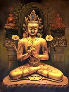 a golden buddha statue sitting on top of a table