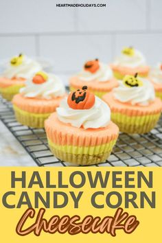 halloween candy corn cheesecake cupcakes on a cooling rack