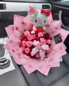 a hello kitty bouquet with roses in it