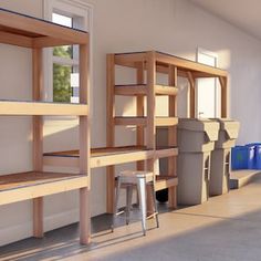 a room filled with lots of wooden shelves next to a blue trash can and stools