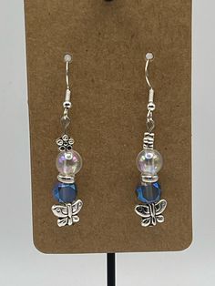 Handmade Earrings - Butterfly Series Each piece is meticulously handcrafted using craft wire, hypoallergenic earring hooks, and premium beads including crystal, glass, wood, ceramic, acrylic, resin, stone, and silicone beads. Care Instructions: Avoid moisture. Remove prior to bathing, showering, swimming, or exercising. Avoid allowing the item to fold when storing.  Shipping Information: Your items will be shipped within 1-2 business days once payment is received. Shipping within the US is via first class mail or you may choose to upgrade to Priority Mail for a small fee. First class shipping is free for orders over $35. Each item is carefully wrapped and packaged for safety during transit. Returns & Exchanges: As this is a wearable item, I do not accept returns or exchanges on this item. Adjustable Dangle Crystal Earrings With Ear Wire, Glass Beaded Dangle Earrings For Gift, Handmade Glass Crystal Drop Earrings, Glass Beaded Earrings For Gift, Adjustable Czech Glass Crystal Earrings, Adjustable Czech Glass Earrings With Ear Wire, Nickel-free Czech Glass Earrings For Crafting, Hypoallergenic Czech Glass Dangle Earrings, Dangle Crystal Earrings With Czech Glass For Gift