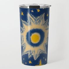 a blue and yellow travel mug with stars on it