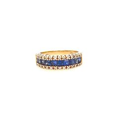 a gold ring with blue and white stones