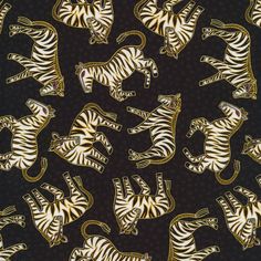 a black background with white and gold zebras on it's sides, all facing different directions