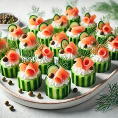 cucumber and smoked salmon appetizers on a platter